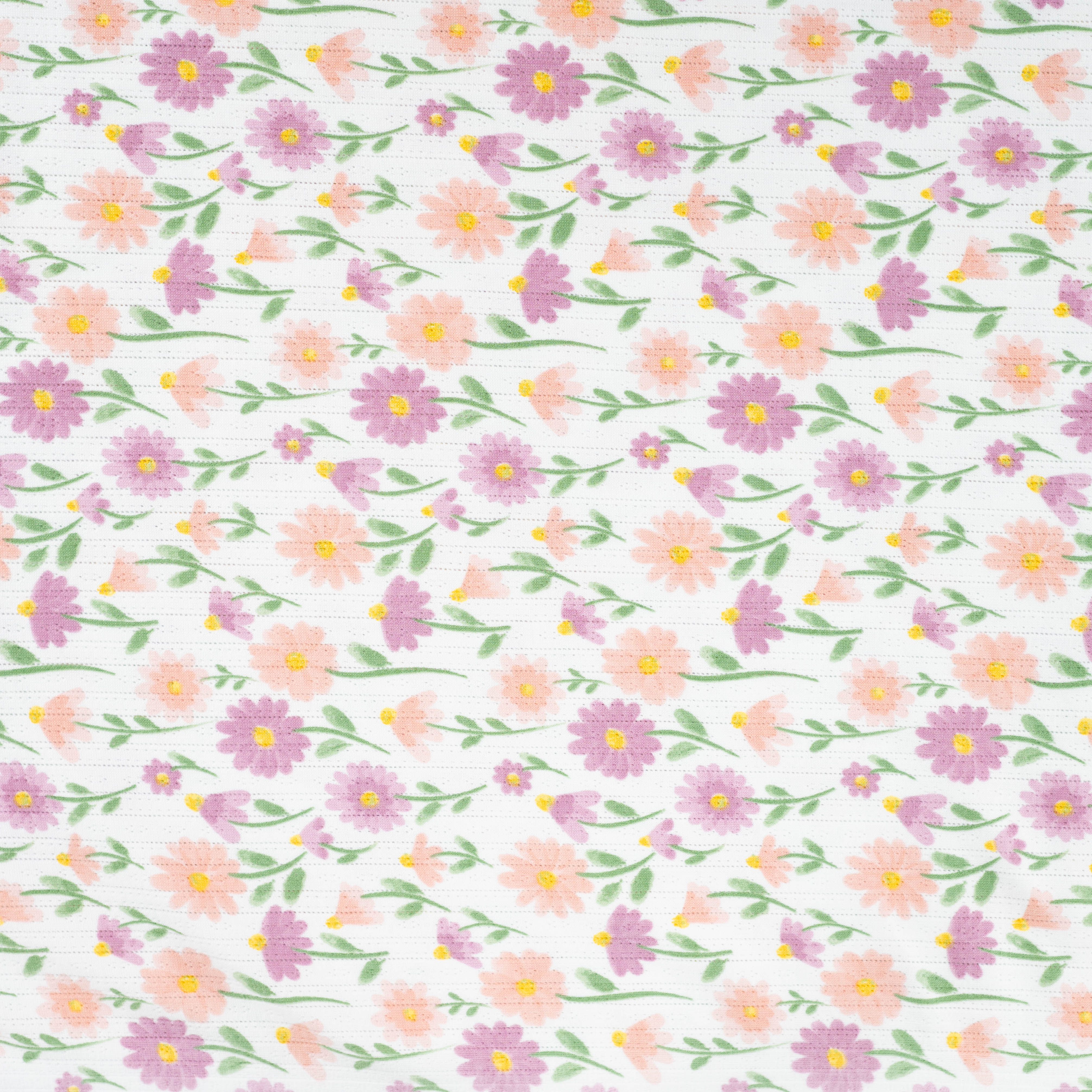 Tissu Jersey Ajouré Pâquerettes pastel