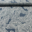Tissu jean stretch bleu motif feuilles tropicales