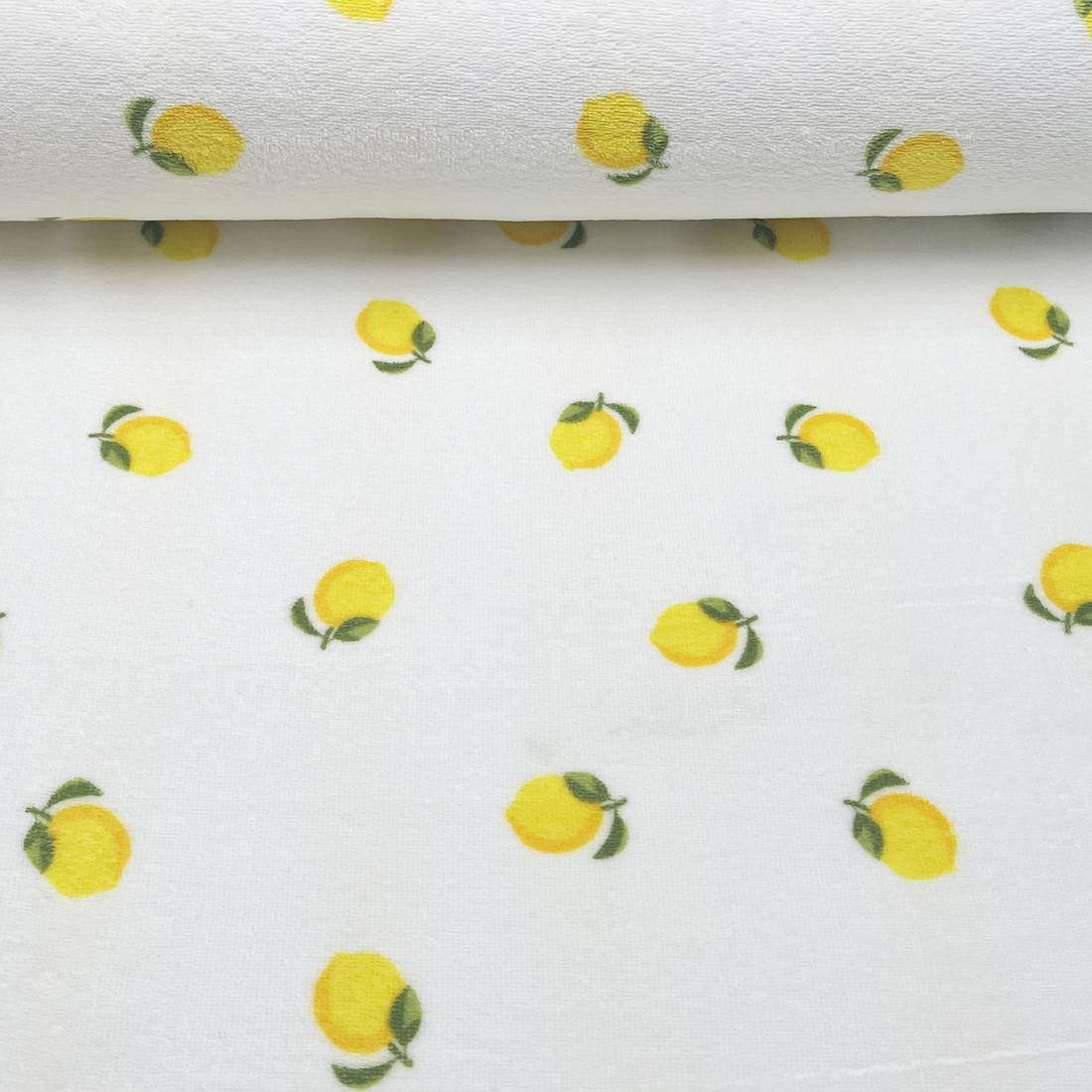 Tissu éponge blanc avec imprimé citrons frais