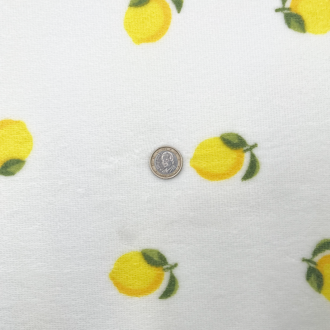 Tissu éponge doux blanc à motif citrons
