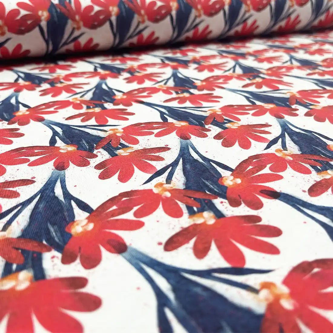 Jersey à fleurs rouges et feuillage bleu