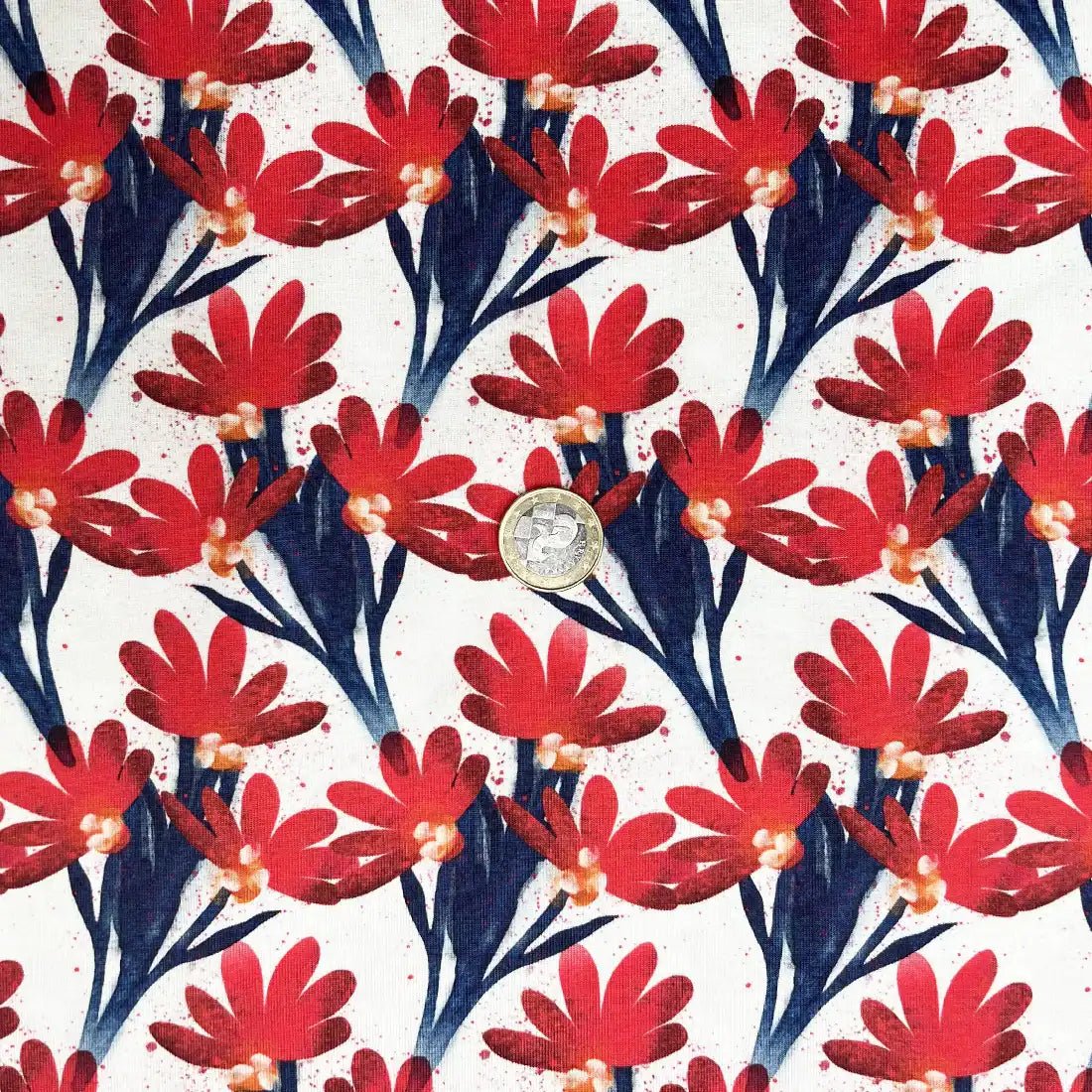 Jersey à fleurs rouges et feuillage bleu