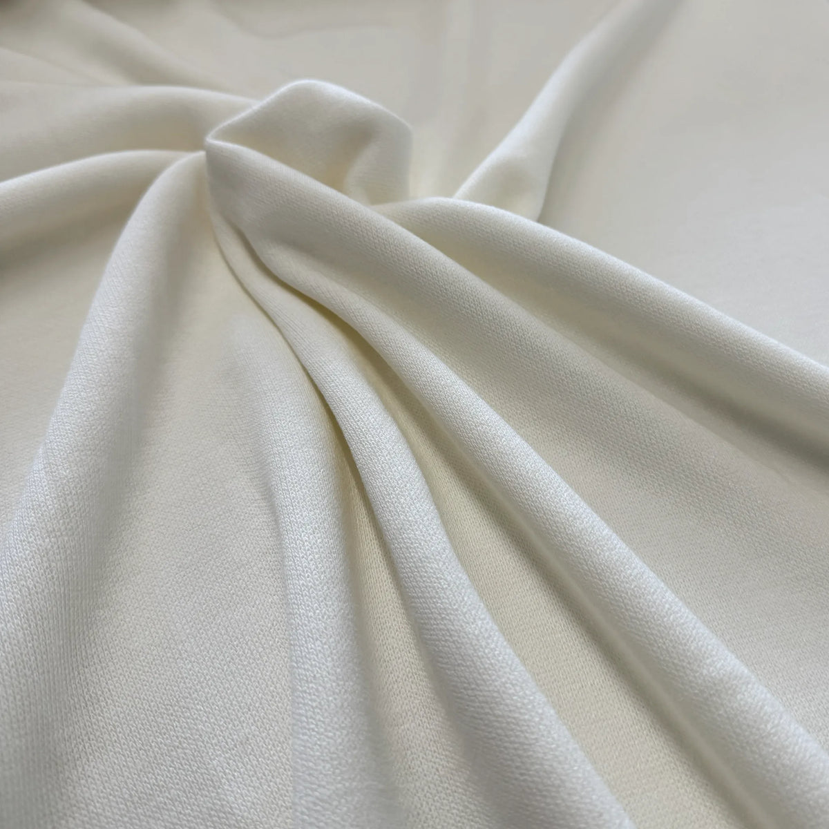 Détail de la maille tricot écru