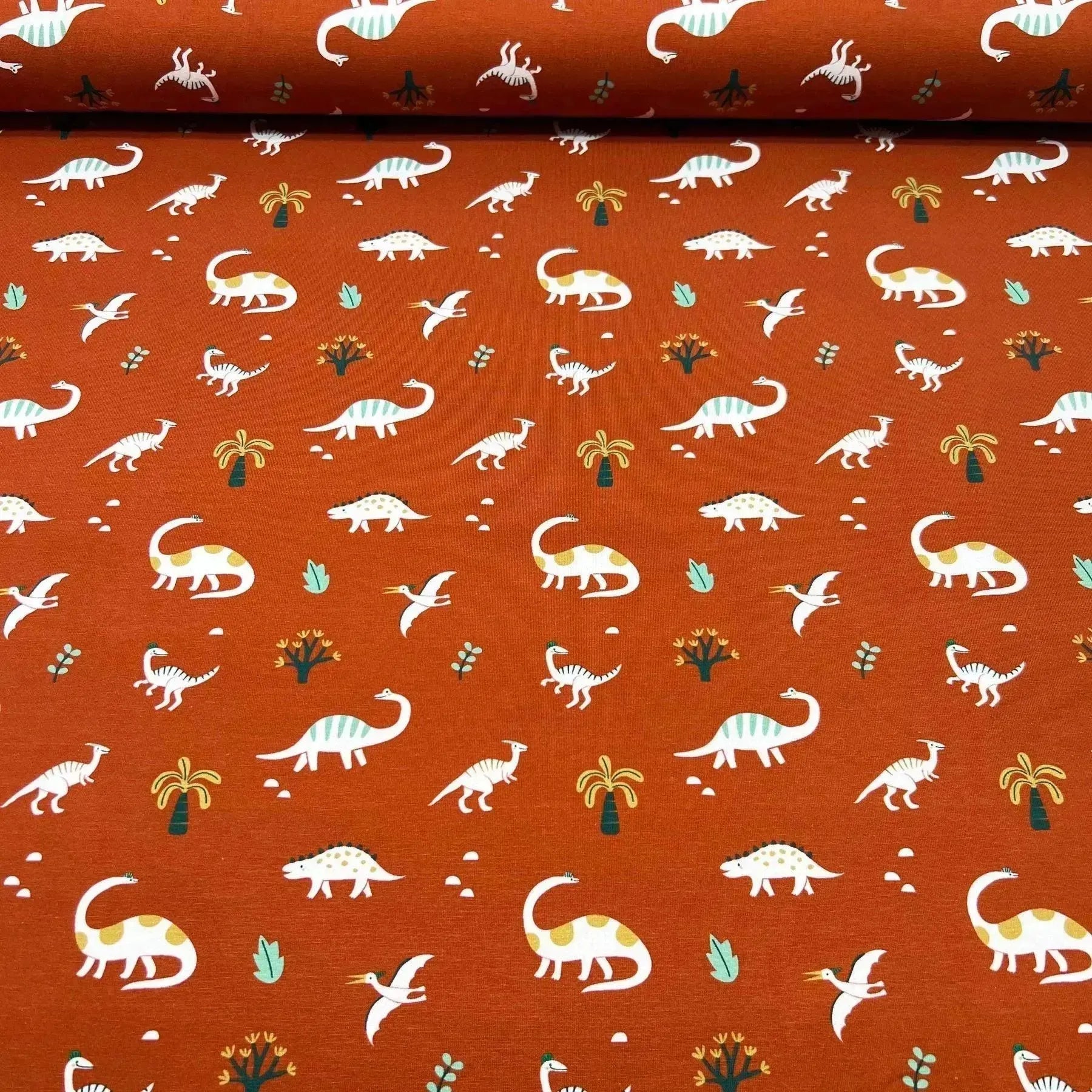 Tissu jersey de coton dino fond terre