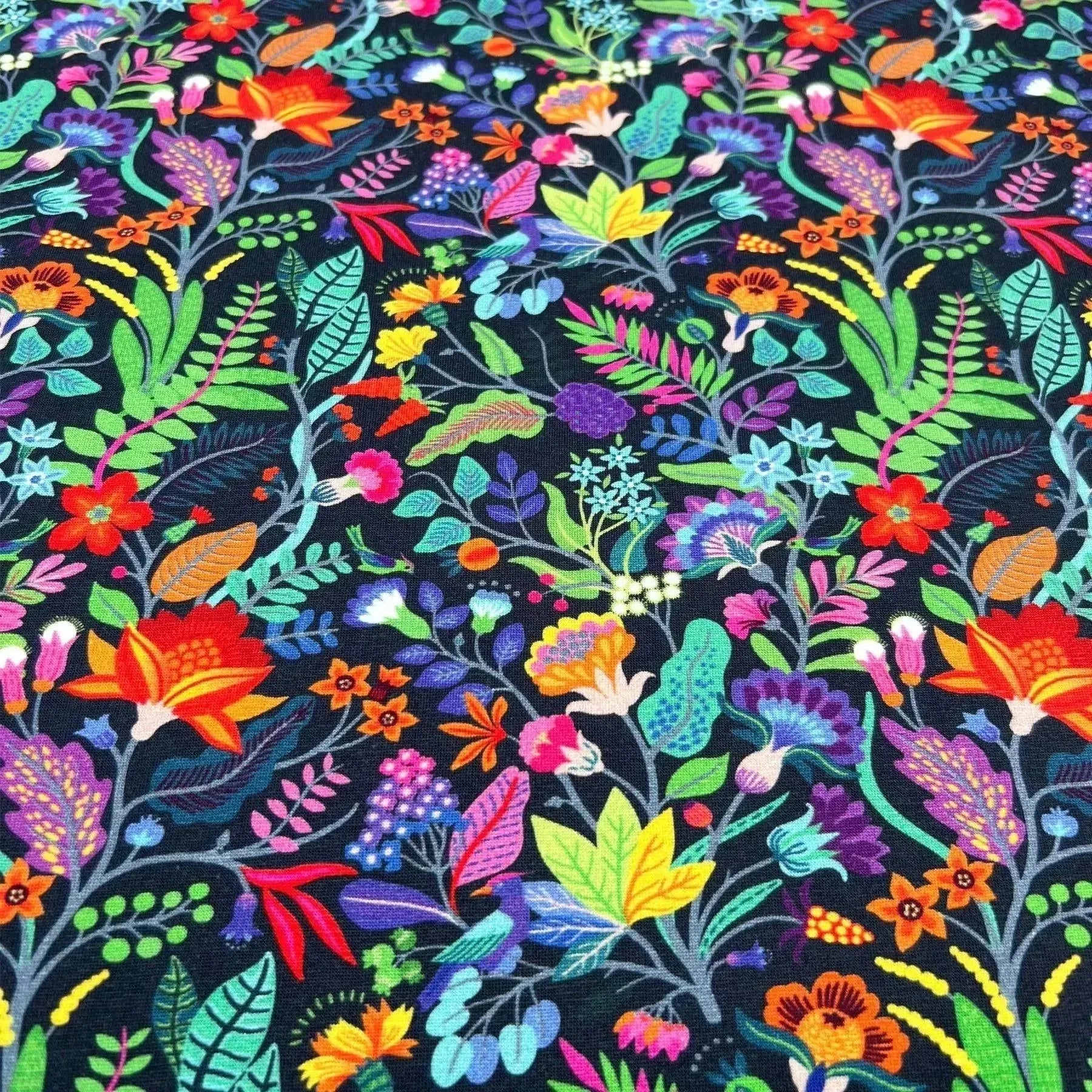 Tissu jersey de coton fleurs sauvages fond bleu