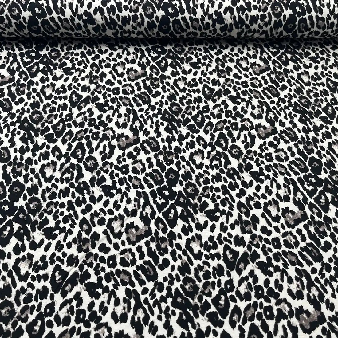 Tissu jersey imprimé léopard noir et beige
