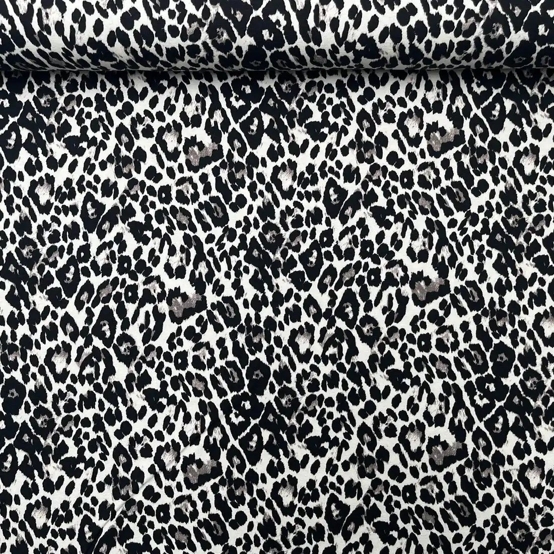 Tissu jersey imprimé léopard noir et beige