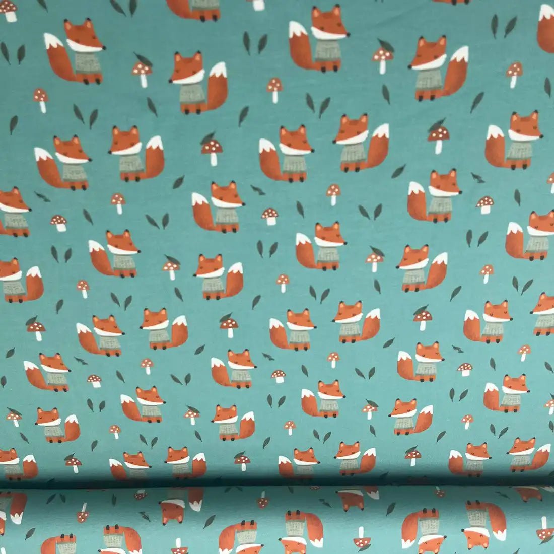 Tissu jersey imprimé renards – vert canard et orange