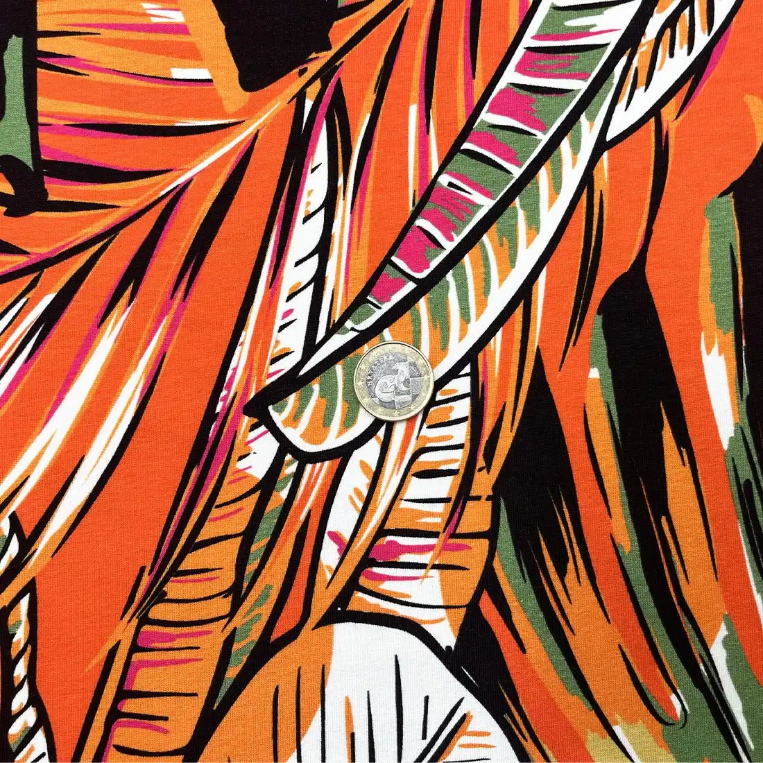 Tissu Jersey tropical orange – Feuilles exotiques colorées