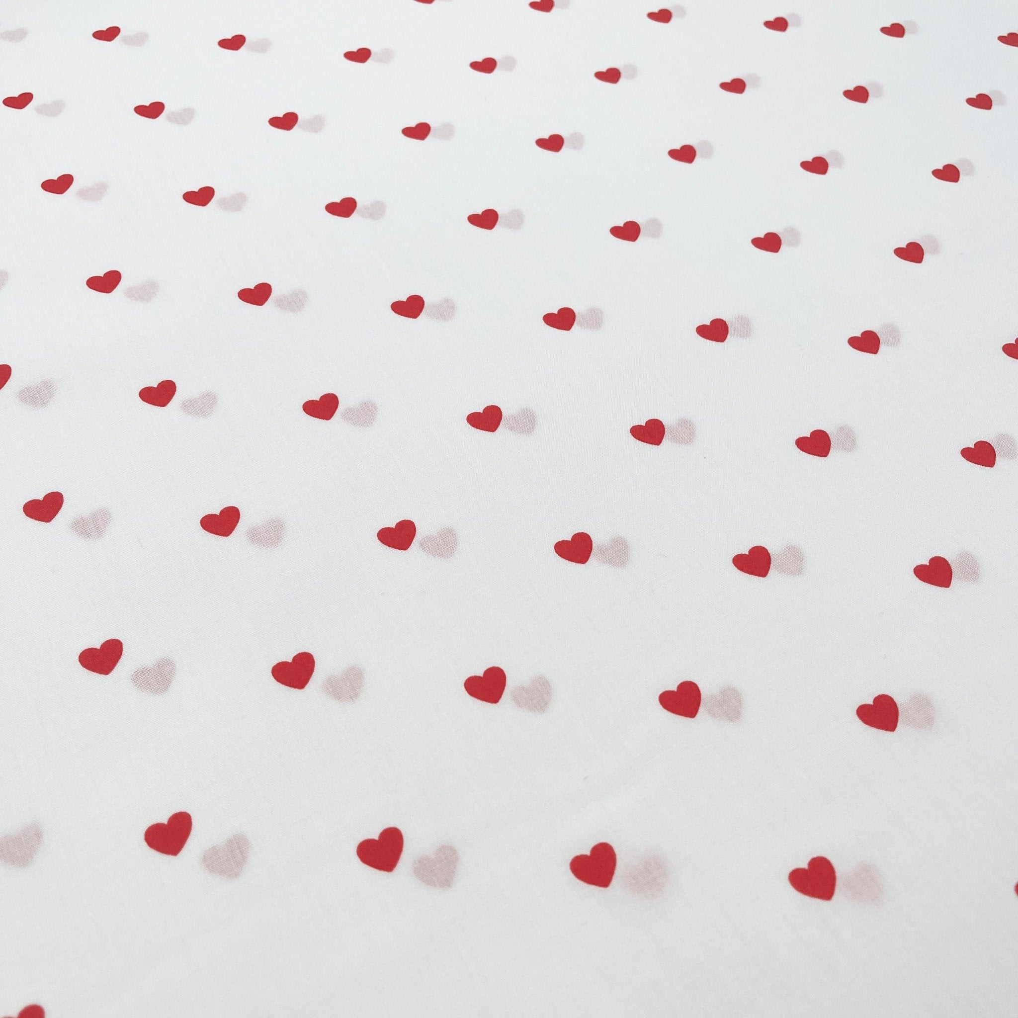 Tissu Popeline de coton cœurs sur fond blanc