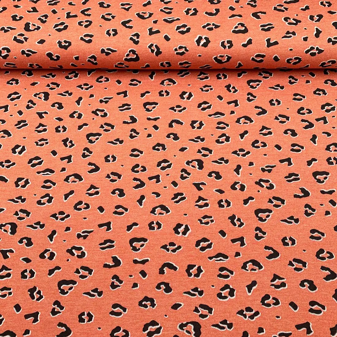 Tissu sweat orange à relief léopard