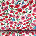 Tissu French Terry motif coquelicots et papillons bleus