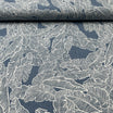 Tissu jean stretch bleu motif feuilles tropicales