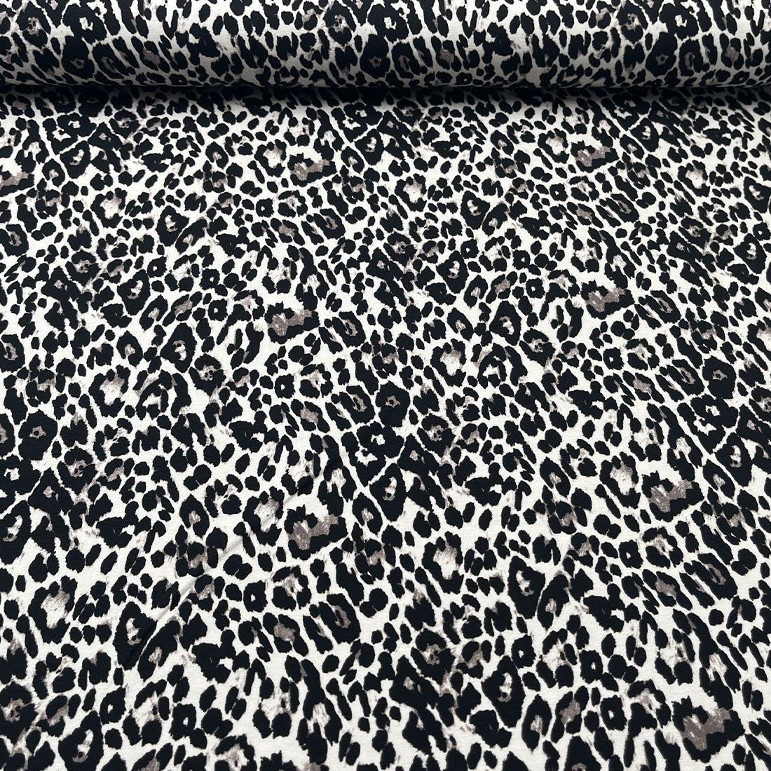 Tissu jersey léopard noir et beige