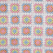 Pastel granny square crochet fabric