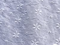 Tissu broderie anglaise fleurs étoilées