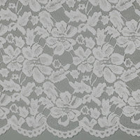 Tissu dentelle blanche fleurie à bord festonné