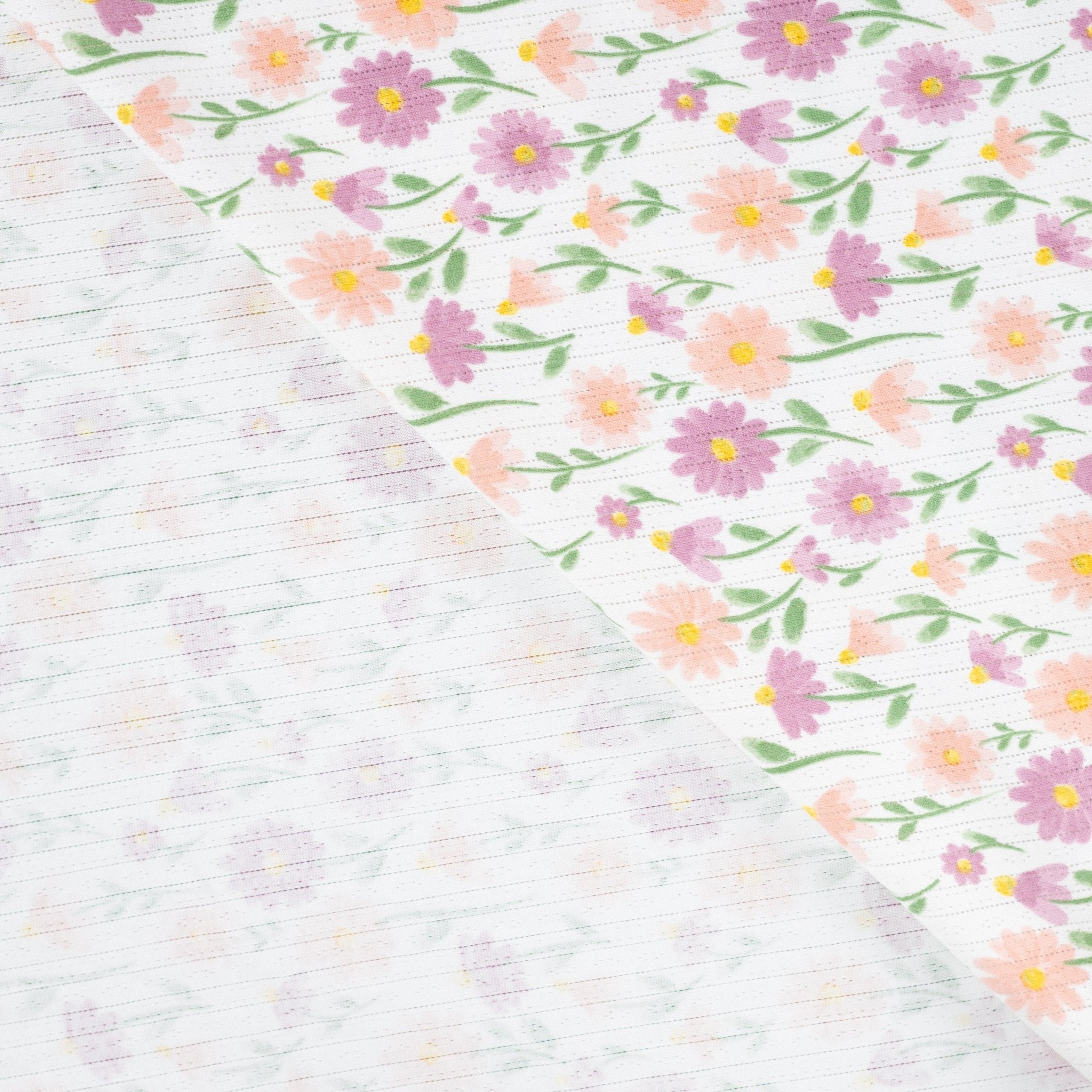 Tissu Jersey Ajouré Pâquerettes pastel