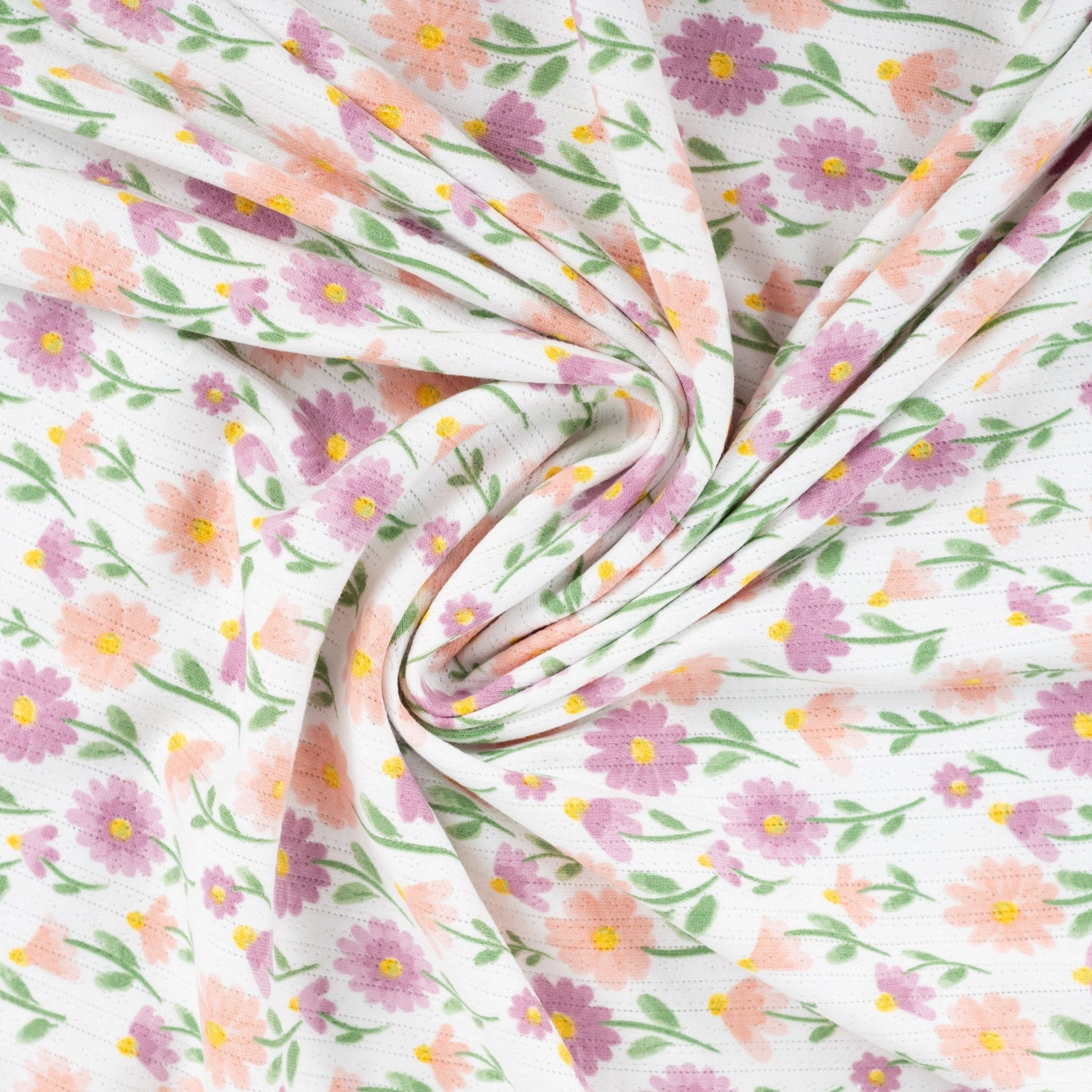 Tissu Jersey Ajouré Pâquerettes pastel