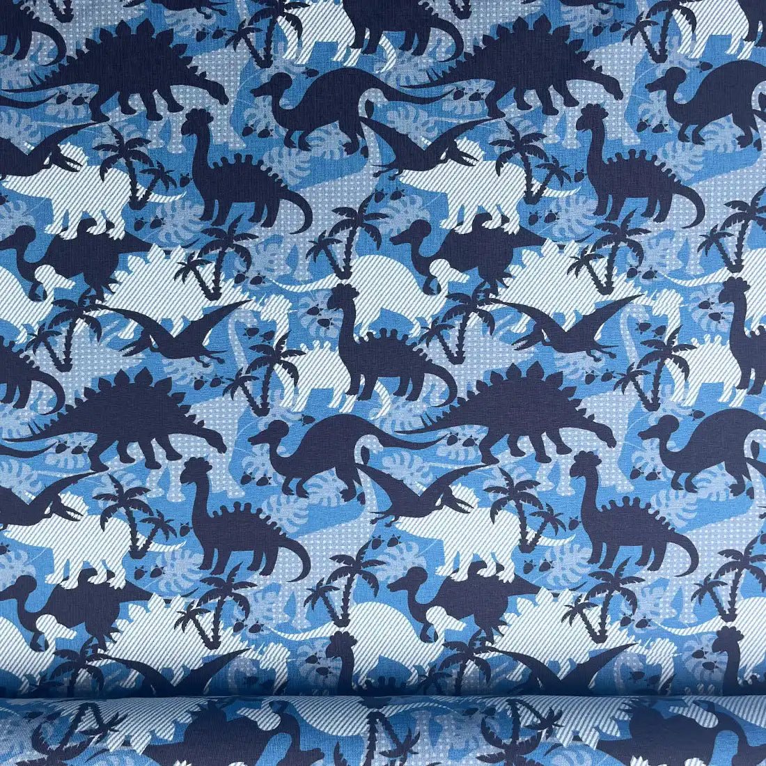 Tissu jersey imprimé dinosaures – bleu et blanc