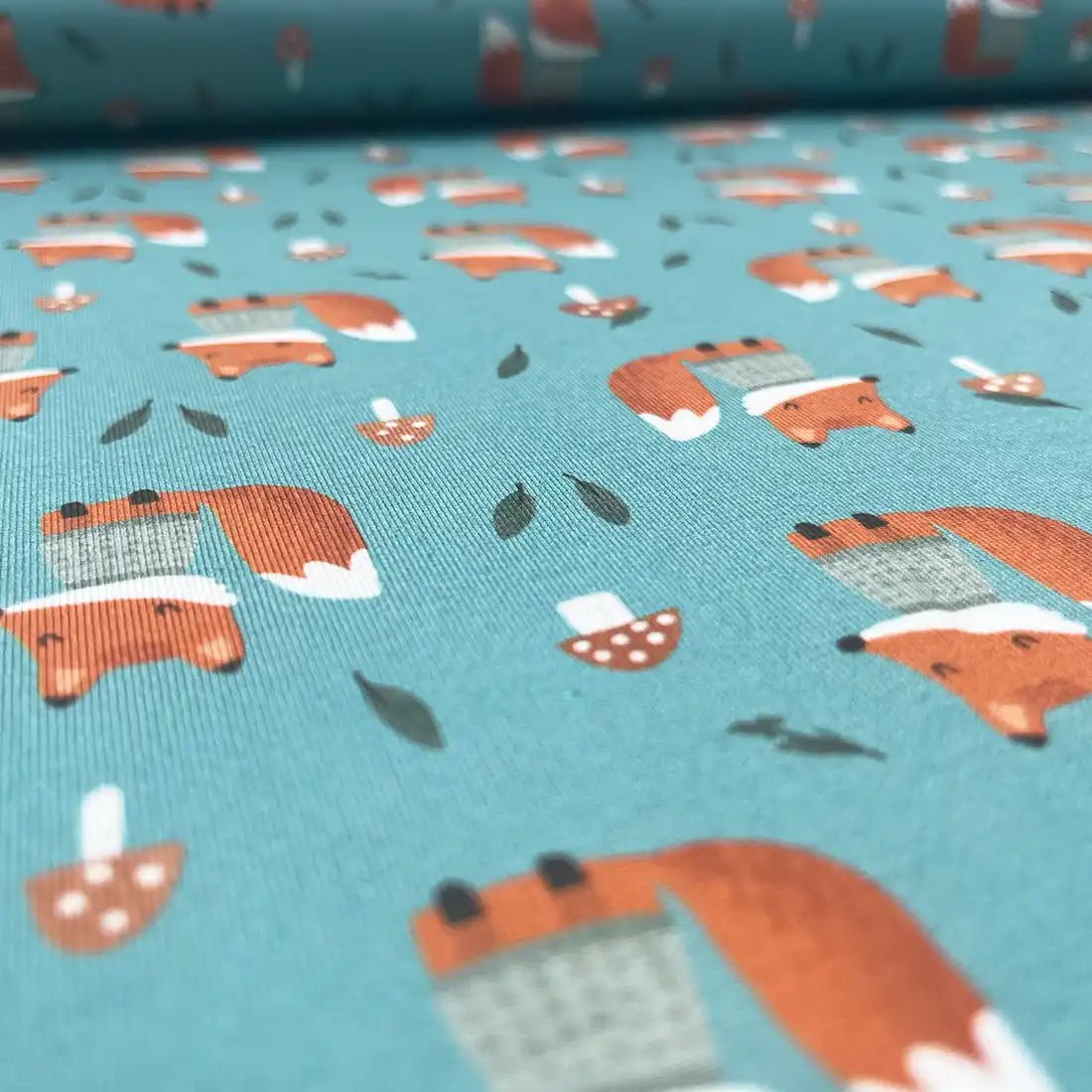 Tissu jersey imprimé renards – vert canard et orange