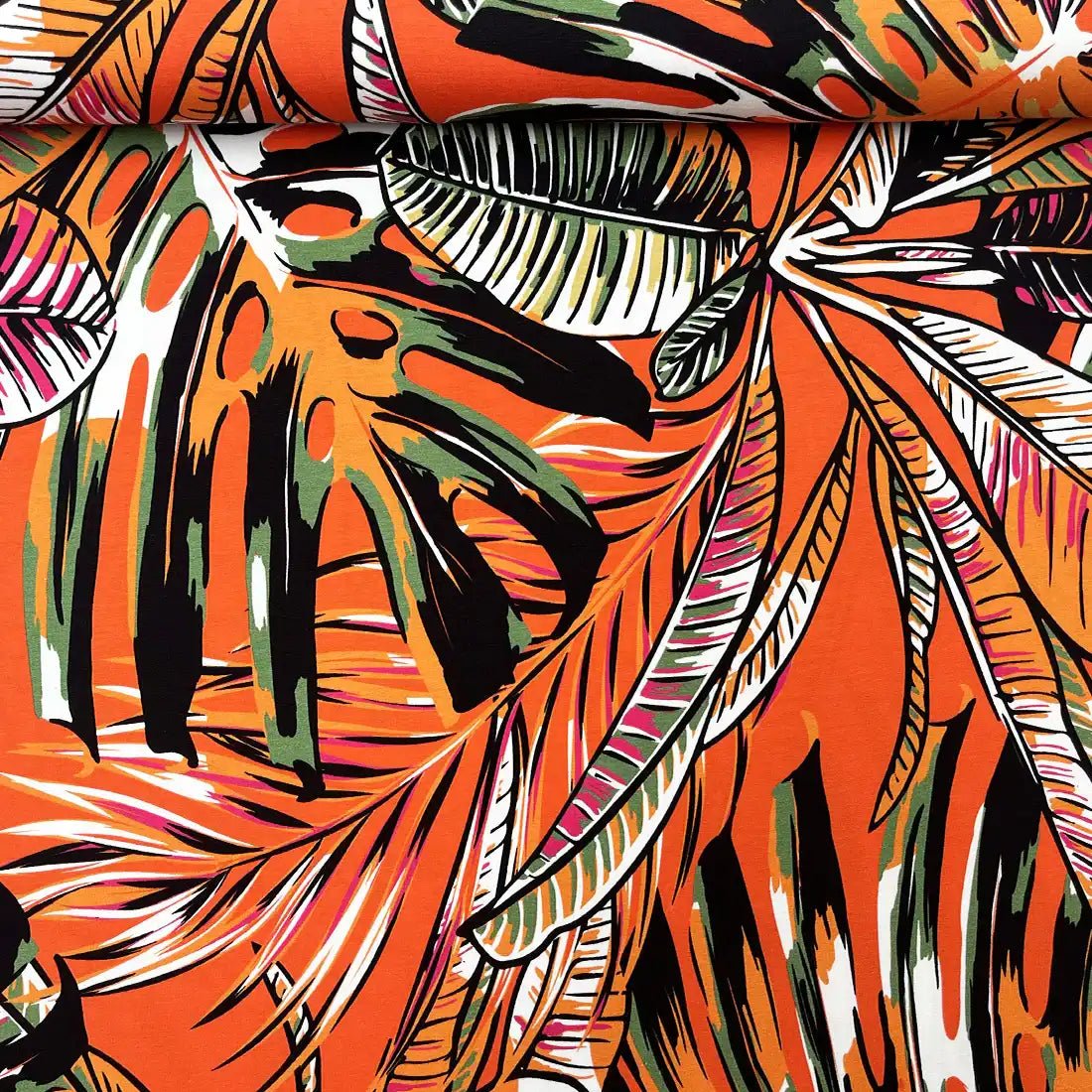 Tissu Jersey tropical orange – Feuilles exotiques colorées