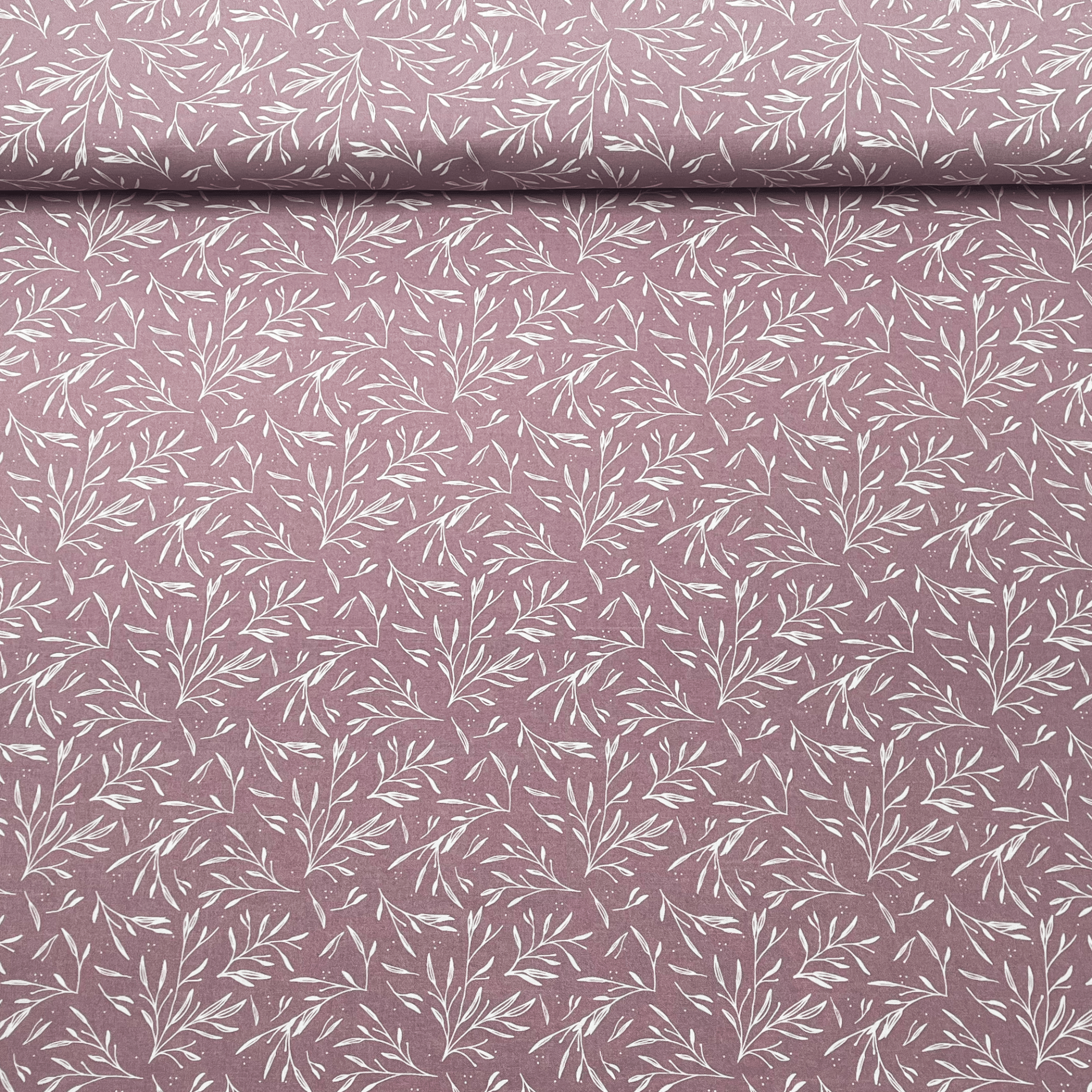 Tissu Popeline de coton feuillage blanc sur fond mauve