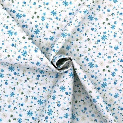 Tissu Popeline de coton fleurs bleues et vertes