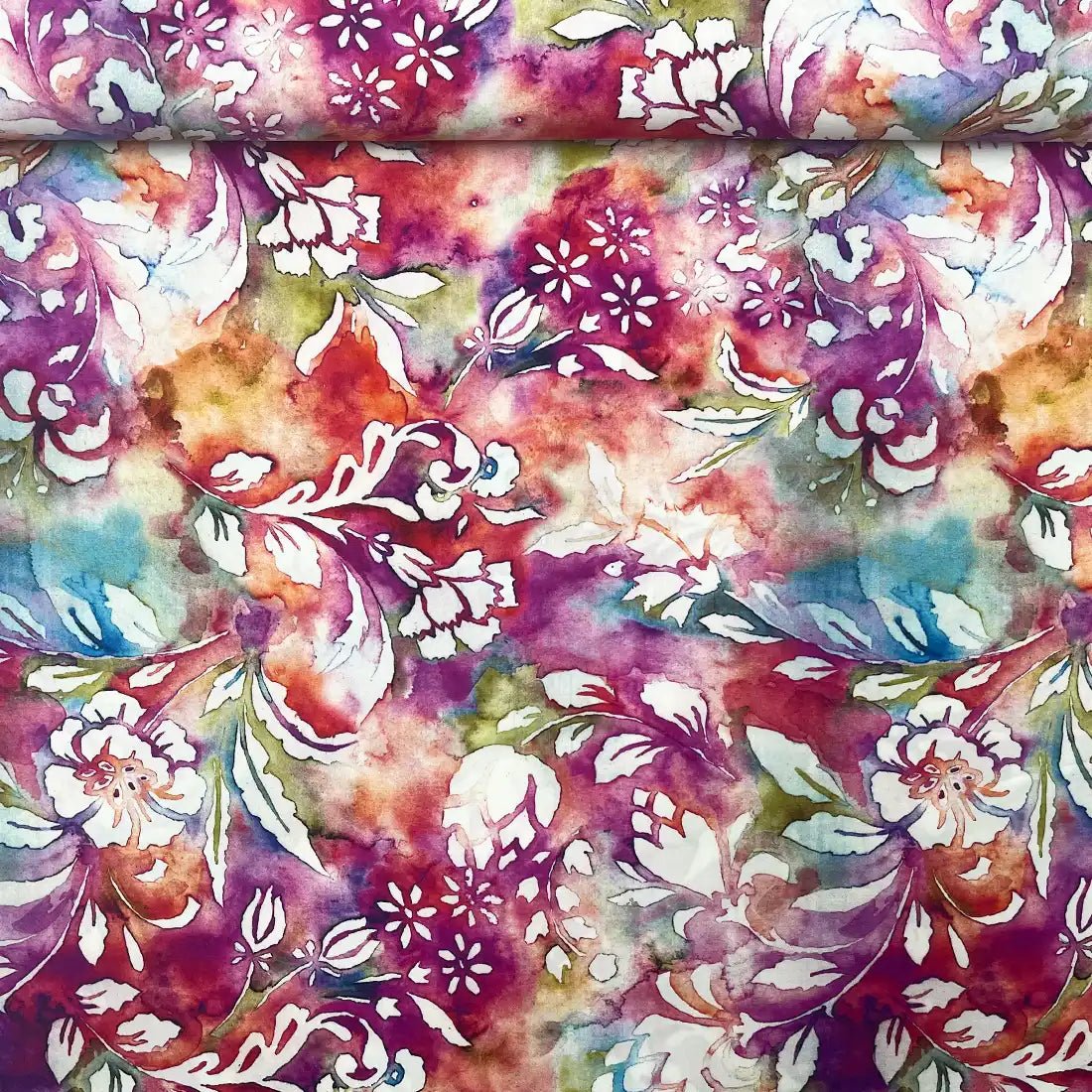 Tissu viscose fleurs et feuillage sur fond multicolore effet aquarelle